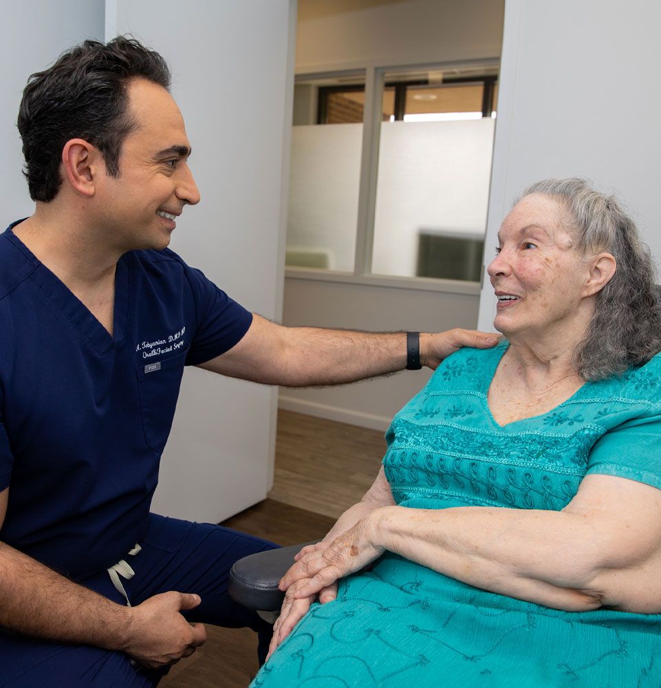 drt with implant patient discussing treatment option